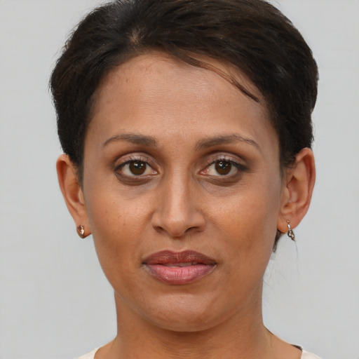 Joyful white adult female with short  brown hair and brown eyes