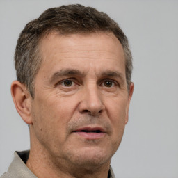 Neutral white middle-aged male with short  brown hair and brown eyes