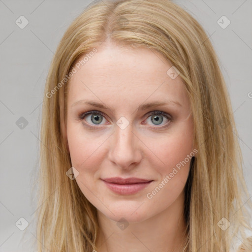 Joyful white young-adult female with long  brown hair and blue eyes