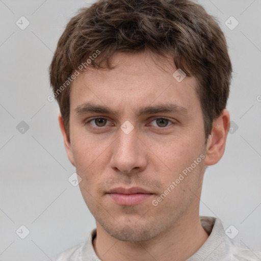 Neutral white young-adult male with short  brown hair and grey eyes