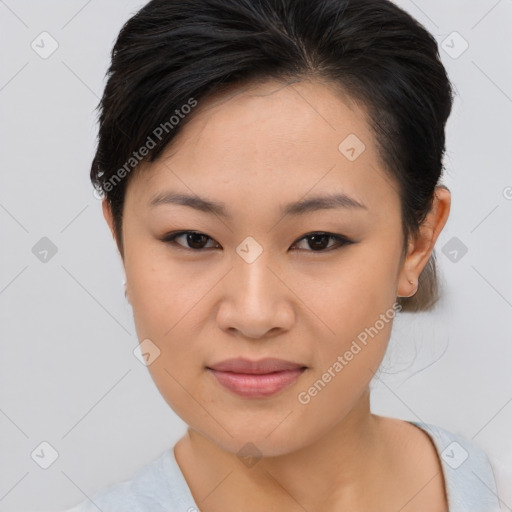 Joyful asian young-adult female with short  brown hair and brown eyes