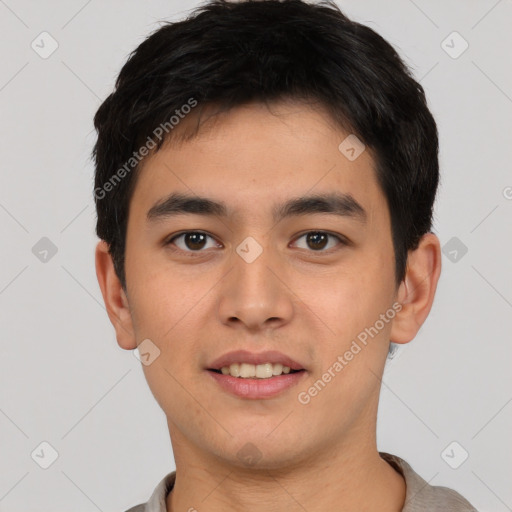 Joyful white young-adult male with short  black hair and brown eyes