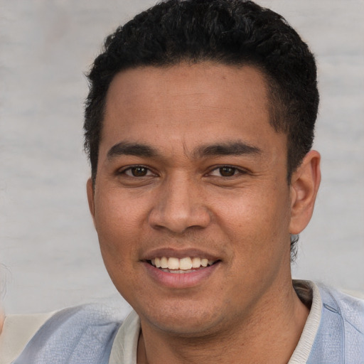 Joyful white young-adult male with short  black hair and brown eyes