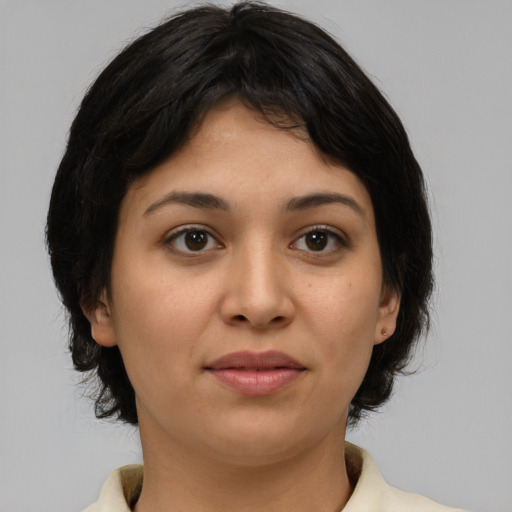 Joyful asian young-adult female with medium  brown hair and brown eyes