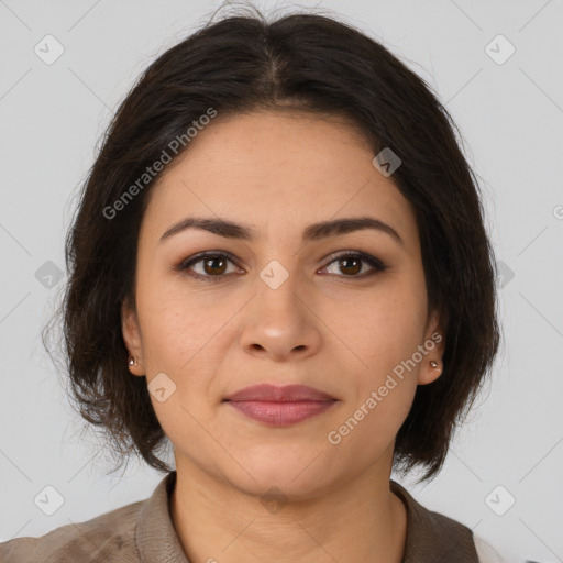 Joyful latino young-adult female with medium  brown hair and brown eyes