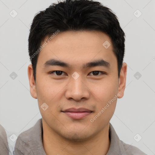 Joyful white young-adult male with short  black hair and brown eyes