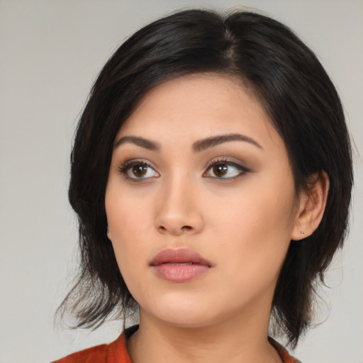 Neutral asian young-adult female with medium  black hair and brown eyes
