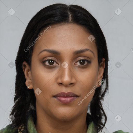 Joyful black young-adult female with long  brown hair and brown eyes