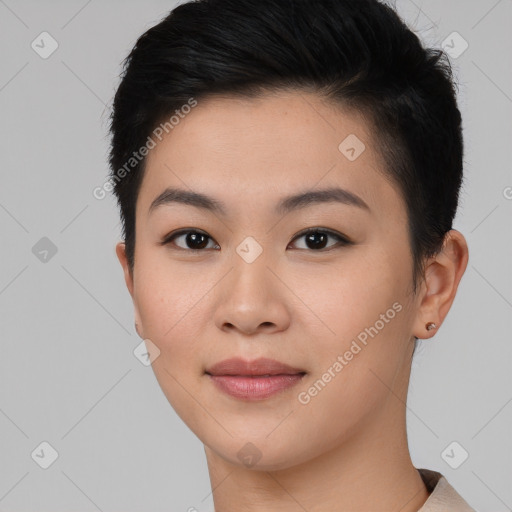 Joyful asian young-adult female with short  black hair and brown eyes