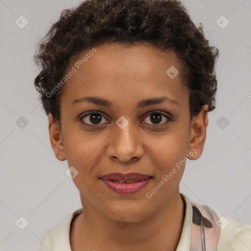 Joyful black young-adult female with short  brown hair and brown eyes