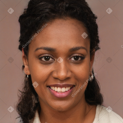 Joyful black young-adult female with long  brown hair and brown eyes