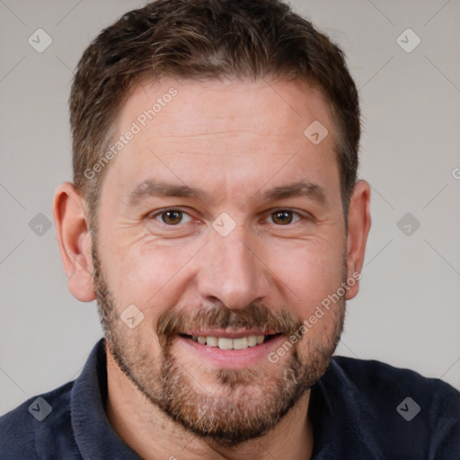 Joyful white adult male with short  brown hair and brown eyes