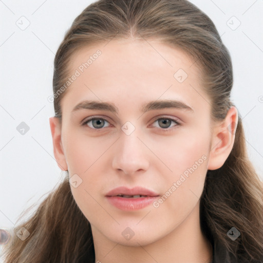 Joyful white young-adult female with long  brown hair and grey eyes