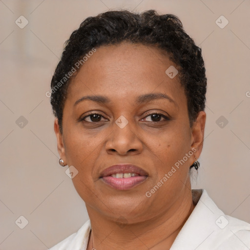 Joyful black adult female with short  brown hair and brown eyes