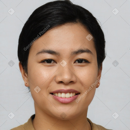 Joyful asian young-adult female with short  black hair and brown eyes