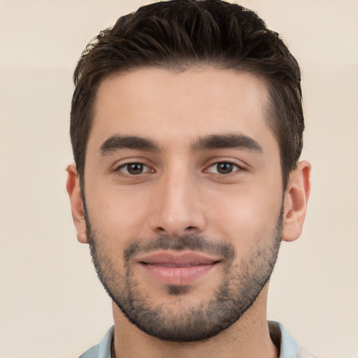 Joyful white young-adult male with short  black hair and brown eyes