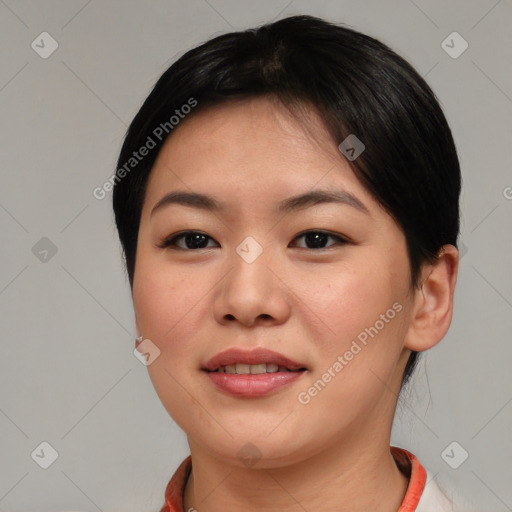 Joyful asian young-adult female with short  brown hair and brown eyes