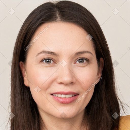 Joyful white young-adult female with long  brown hair and brown eyes