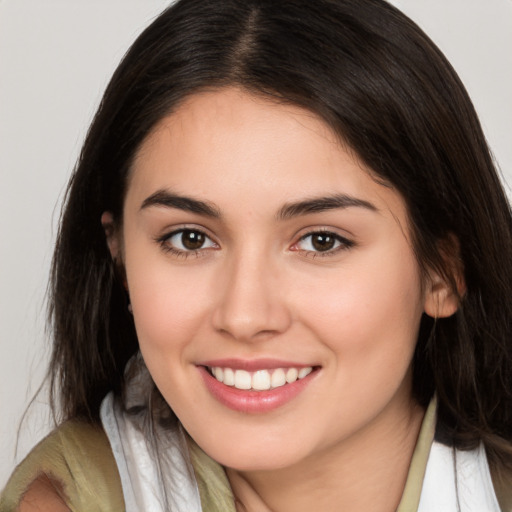 Joyful white young-adult female with medium  brown hair and brown eyes