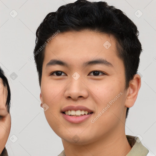 Joyful asian young-adult male with short  black hair and brown eyes