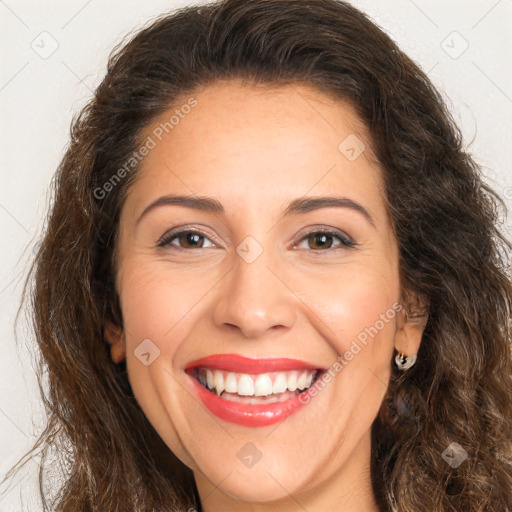 Joyful white adult female with long  brown hair and brown eyes