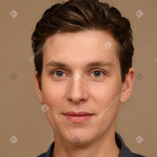 Joyful white adult male with short  brown hair and grey eyes