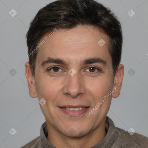 Joyful white adult male with short  brown hair and brown eyes