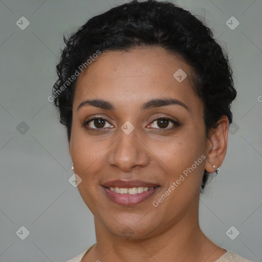 Joyful latino young-adult female with short  brown hair and brown eyes