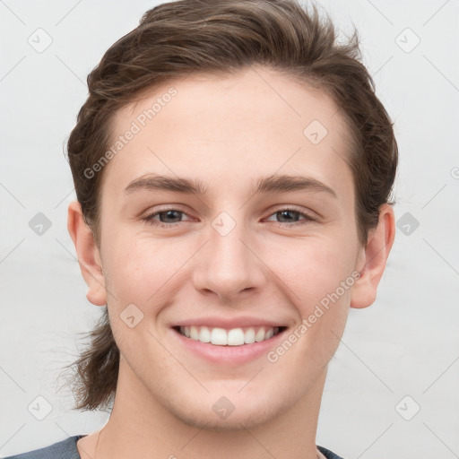 Joyful white young-adult female with short  brown hair and grey eyes