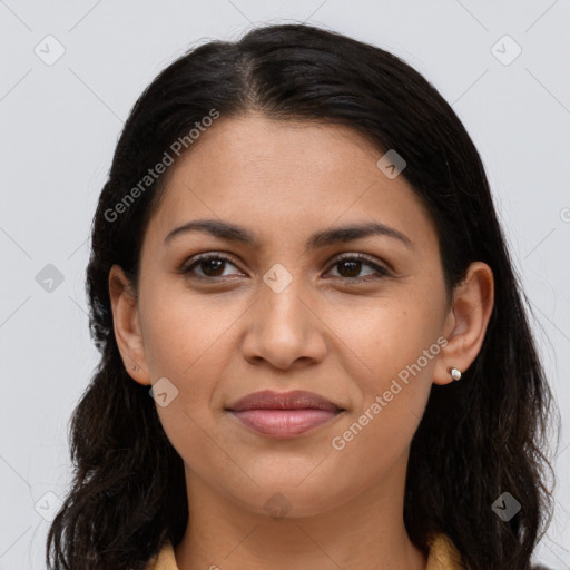 Joyful latino young-adult female with long  brown hair and brown eyes