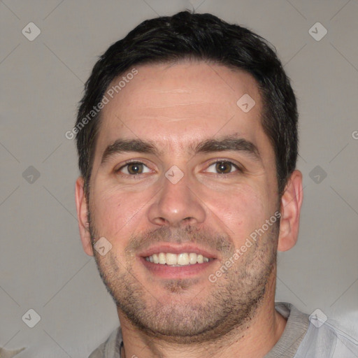 Joyful white young-adult male with short  black hair and brown eyes