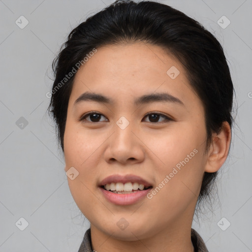 Joyful asian young-adult female with long  brown hair and brown eyes