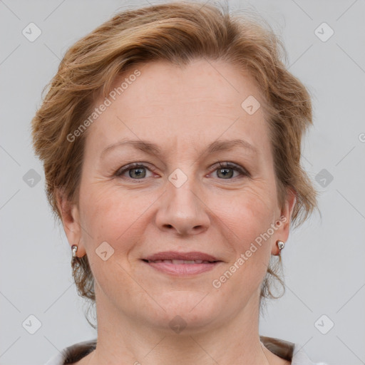 Joyful white adult female with medium  brown hair and grey eyes