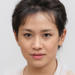 Joyful white child female with medium  brown hair and brown eyes