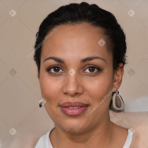 Joyful black young-adult female with short  black hair and brown eyes