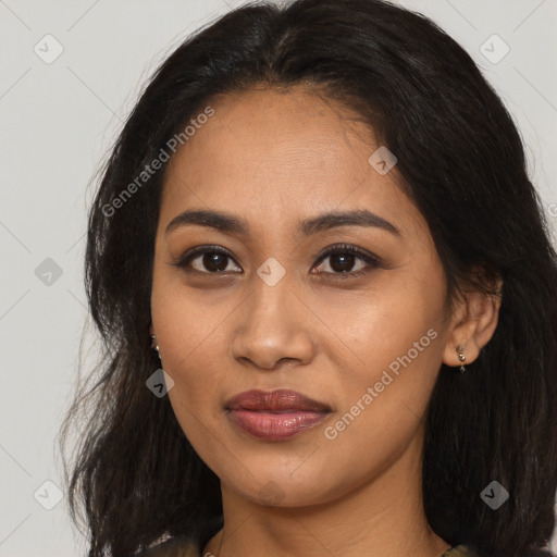 Joyful latino young-adult female with medium  brown hair and brown eyes