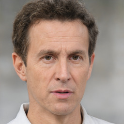 Neutral white middle-aged male with short  brown hair and brown eyes