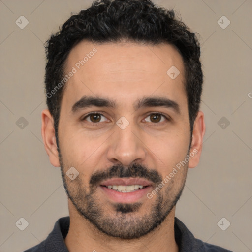 Joyful white young-adult male with short  black hair and brown eyes