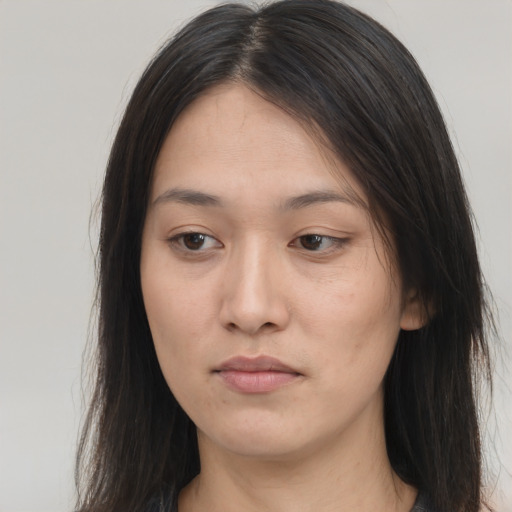 Neutral asian young-adult female with long  brown hair and brown eyes