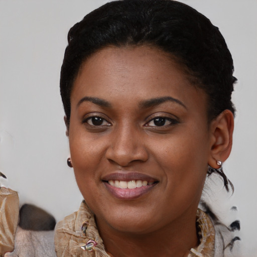 Joyful black young-adult female with medium  black hair and brown eyes