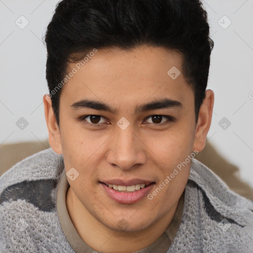 Joyful latino young-adult male with short  brown hair and brown eyes