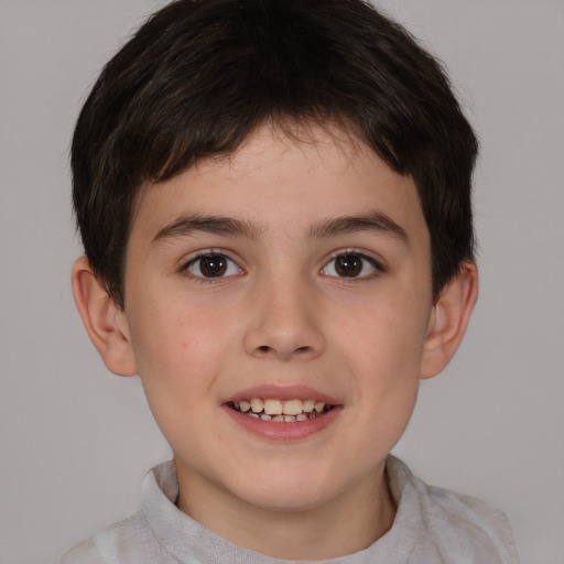 Joyful white child male with short  brown hair and brown eyes