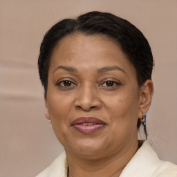 Joyful black adult female with short  brown hair and brown eyes