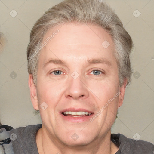 Joyful white adult male with short  brown hair and grey eyes