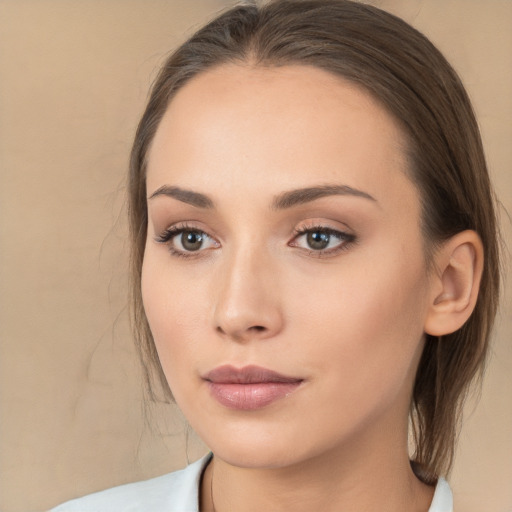 Neutral white young-adult female with medium  brown hair and brown eyes