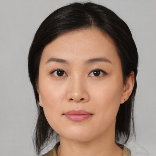 Neutral asian young-adult female with medium  black hair and brown eyes