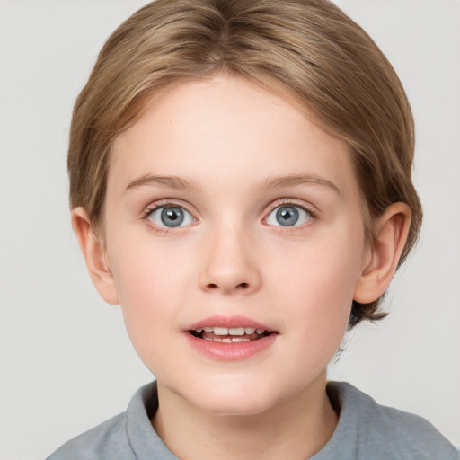 Joyful white child female with short  brown hair and grey eyes