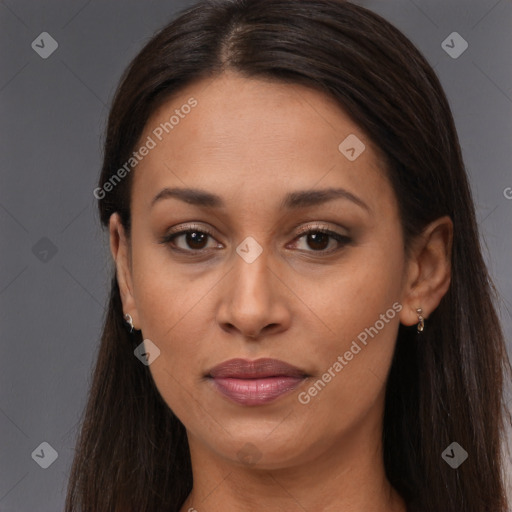 Joyful black adult female with long  brown hair and brown eyes