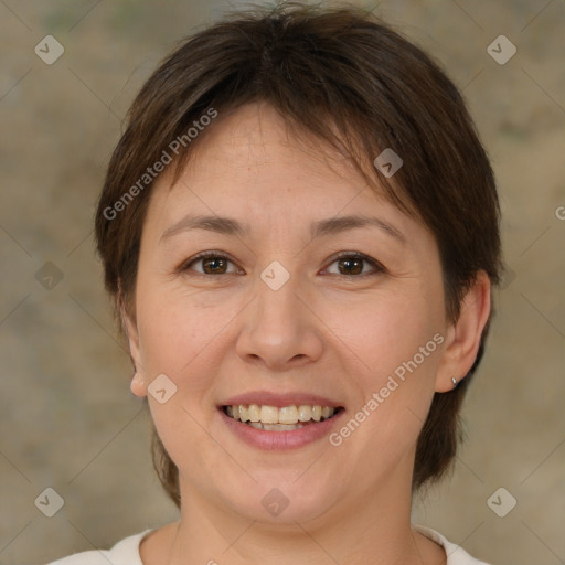 Joyful white adult female with medium  brown hair and brown eyes