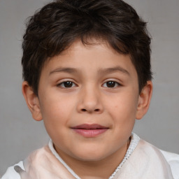 Joyful white child male with short  brown hair and brown eyes